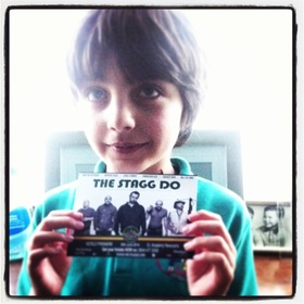 Autoboy holding a Stagg Do flyer from 2014